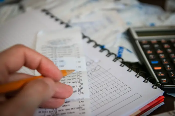 tax-calculations-hand-money-business-save-calculator-savings-taxes-bills-1109928_0.jpg