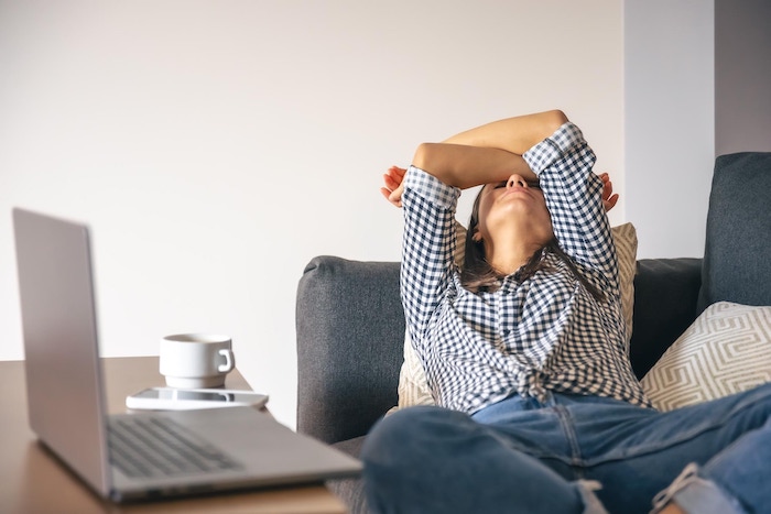 tired-from-work-tech-burnout-woman-front-laptop