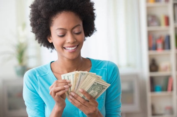 woman-counting-cash-notes-smiling