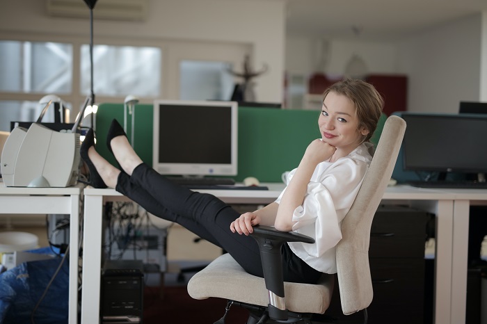 woman-in-office-smiling-legs-up.jpg