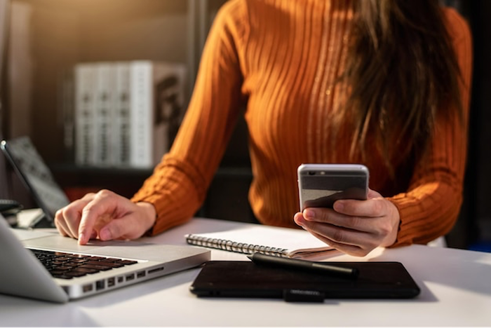 woman-laptop-smartphone-working-notepad-influencer-marketing.png