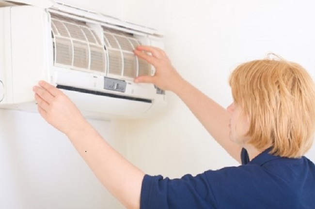 woman-maintaining-cooling-system.jpg