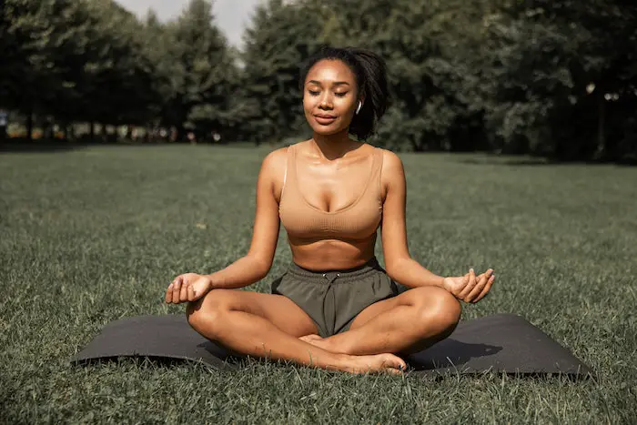 woman_practicing_yoga_in_park.jpg