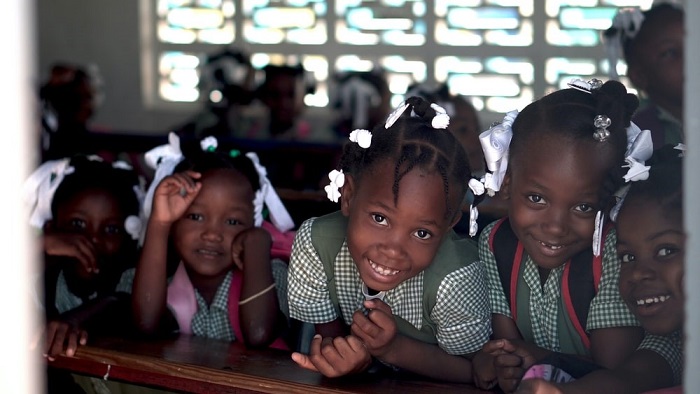 young-girls-smiling-wearing-school-uniform-noble-and-vital-nonprofit-work.jpg